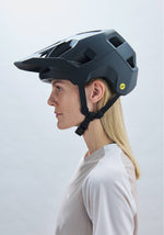 Woman wearing POC Kortal mountain bike helmet in matte black finish