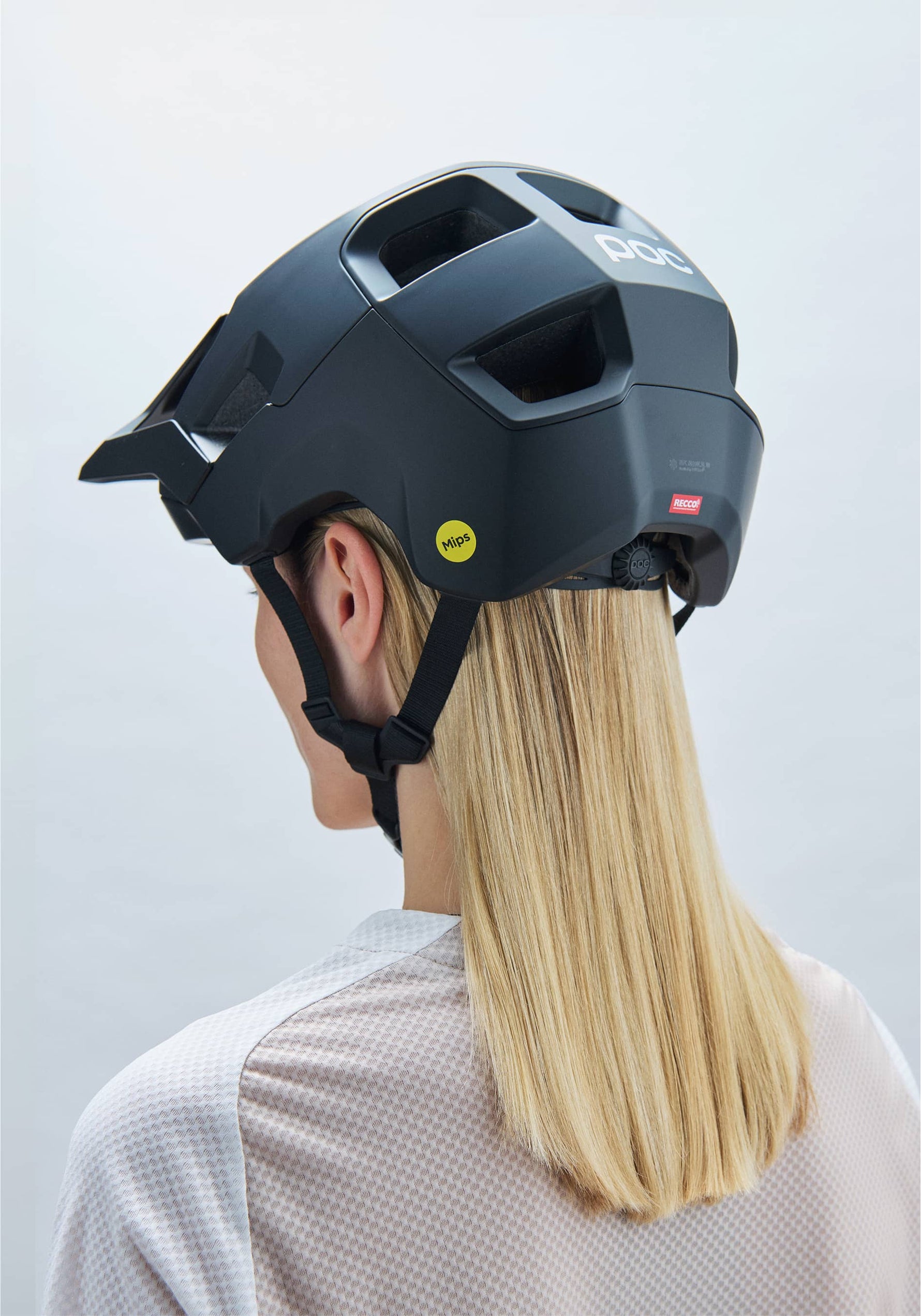 POC Kortal mountain bike helmet in matte black worn by blonde woman