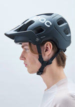 POC Tectal MTB helmet in Uranium Black worn by model showing side profile view