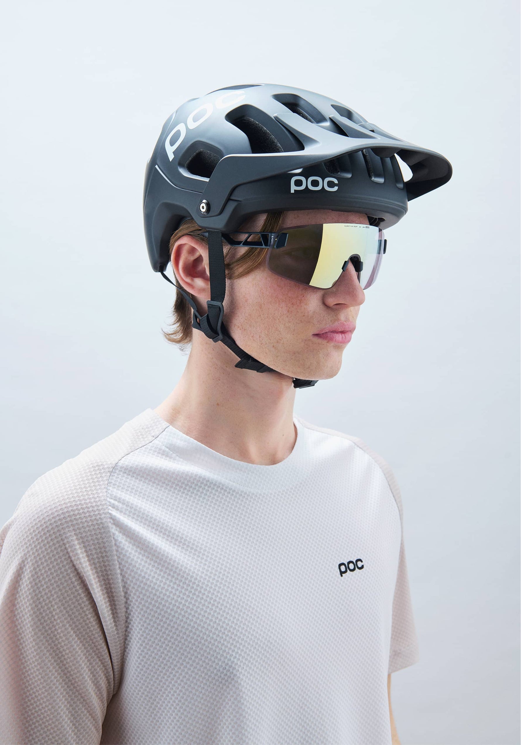 POC Tectal MTB Helmet in Uranium Black worn by cyclist with protective eyewear