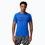 Man wearing Brooks Distance Short Sleeve 3.0 in blue with Brooks logo on chest