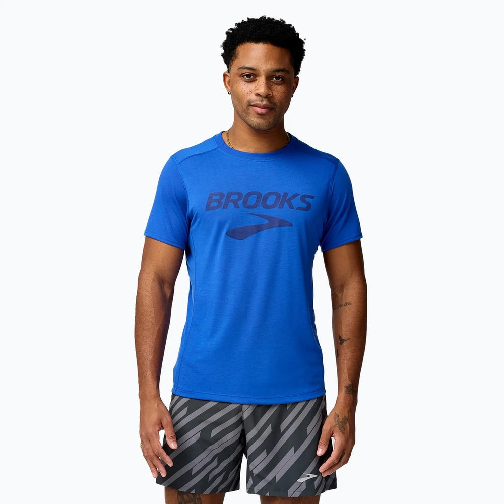 Man wearing Brooks Distance Short Sleeve 3.0 in blue with Brooks logo on chest