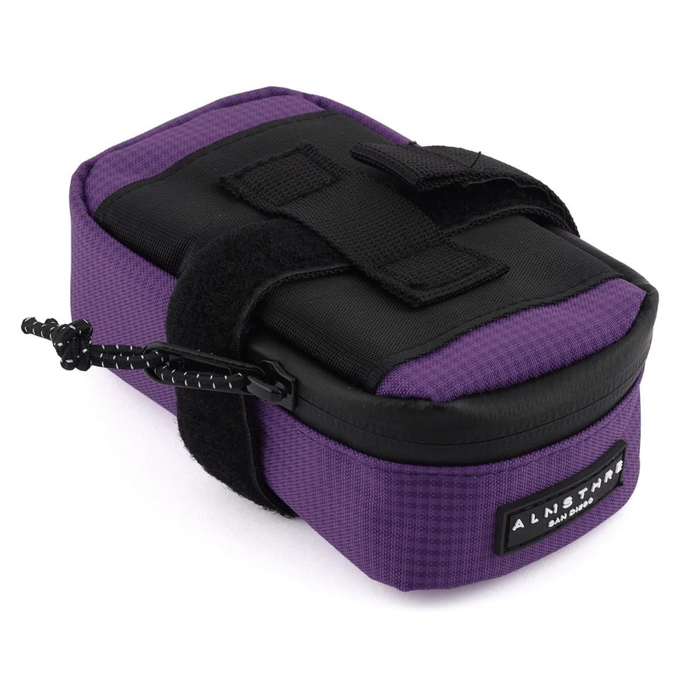 Purple Almsthre Signature saddle bag with black straps and zipper pull