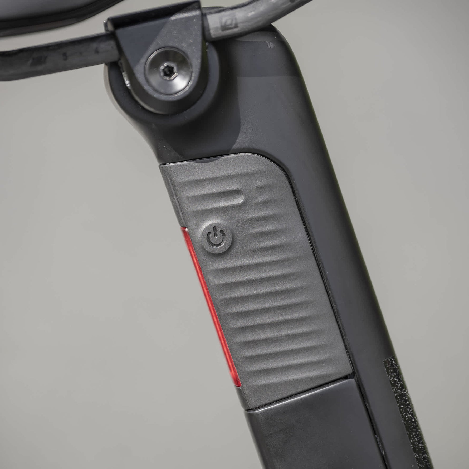 Syncros Campbell rear light in black with red accent mounted on electric scooter stem