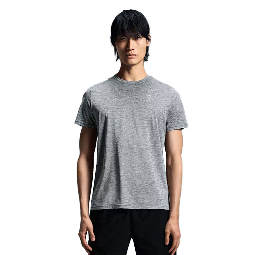 Man wearing gray heathered On Core-T shirt against white background
