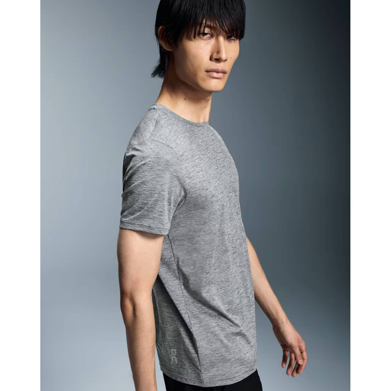 Man wearing heather grey On Core Long-T shirt in studio photo
