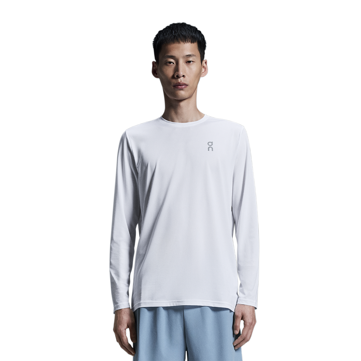 Man wearing On Core Long-T in light gray fade color on white background