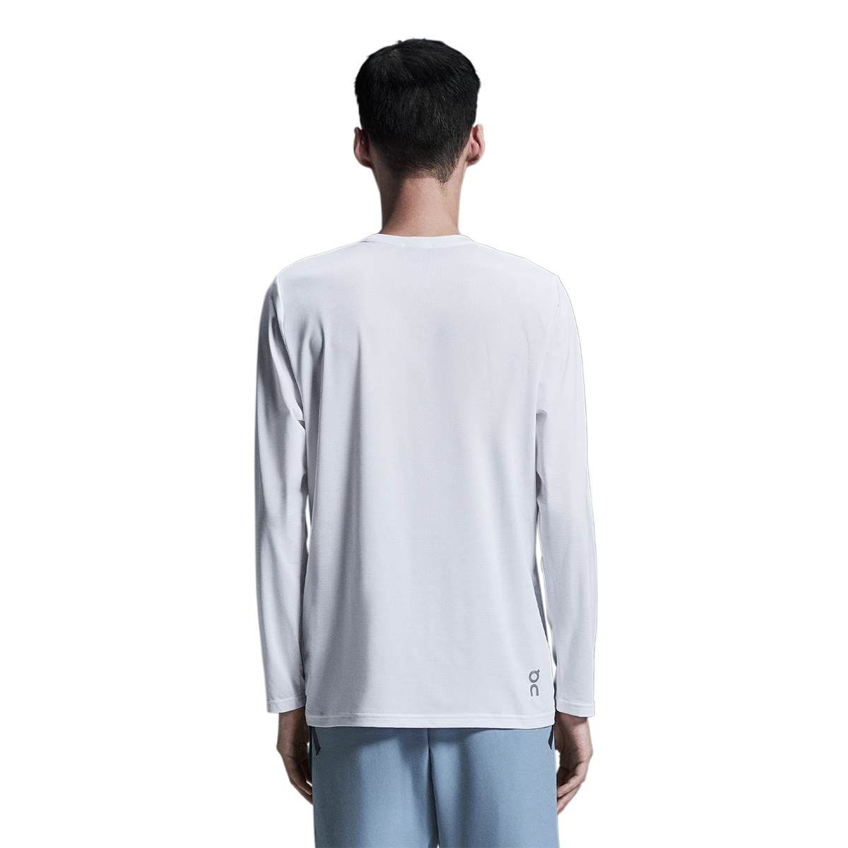 Back view of man wearing On Core Long-T in light gray fade color