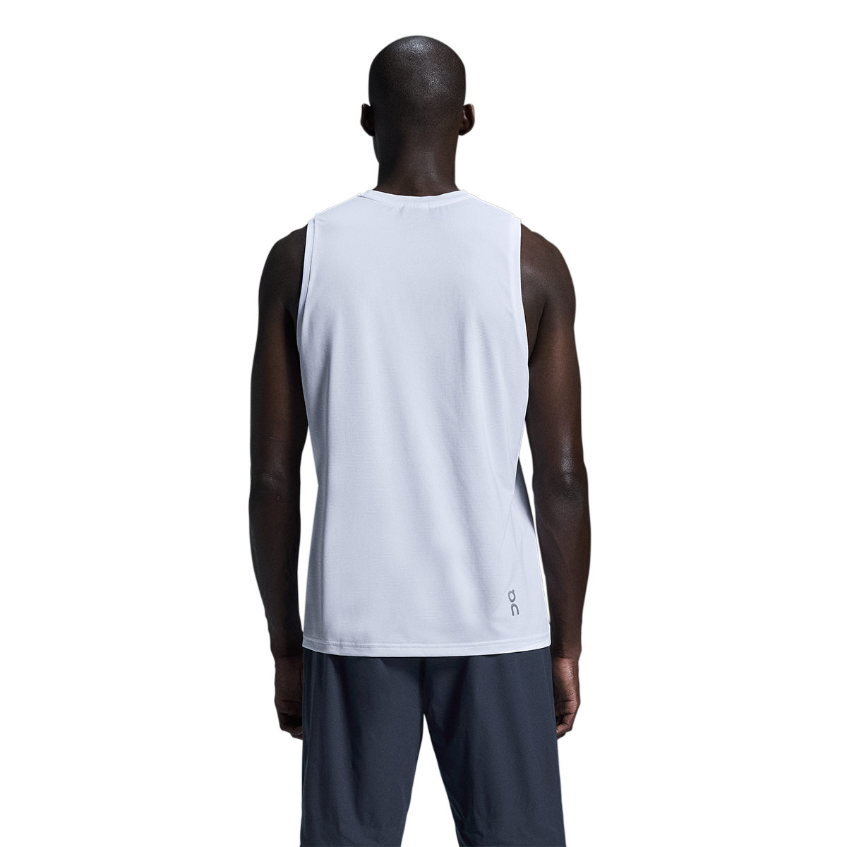 Back view of man wearing On Core Tank in heather gray