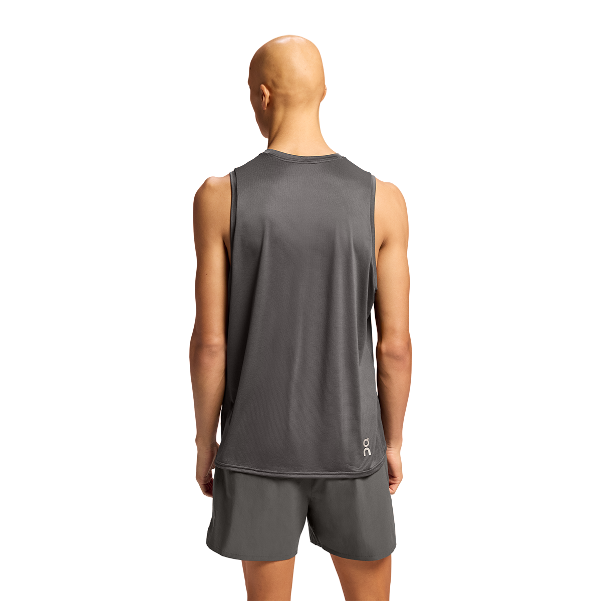 Back view of man wearing charcoal gray On Core Tank with matching shorts