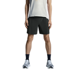 Man wearing On 5-inch lightweight running shorts in black with white tank top