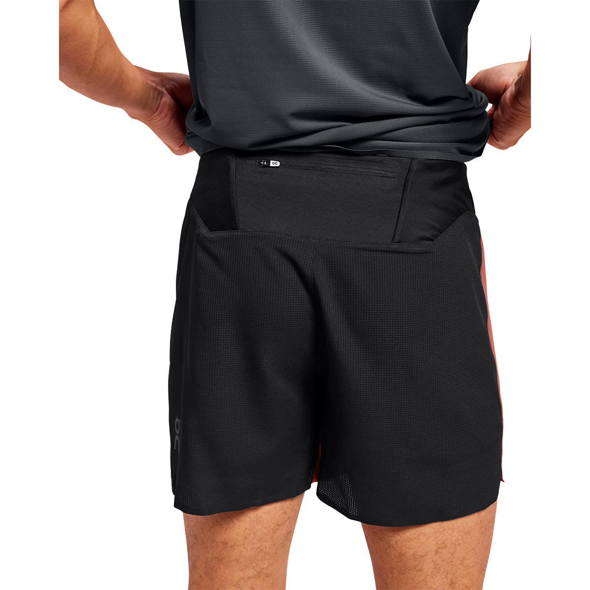 Man wearing black On 5-inch lightweight running shorts with zippered back pocket