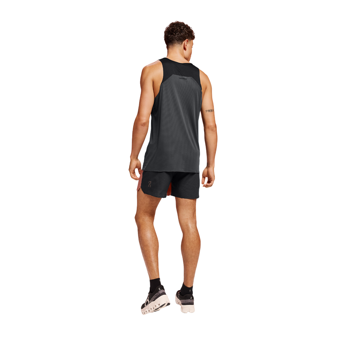 Man wearing black On 5-inch lightweight running shorts, back view studio shot