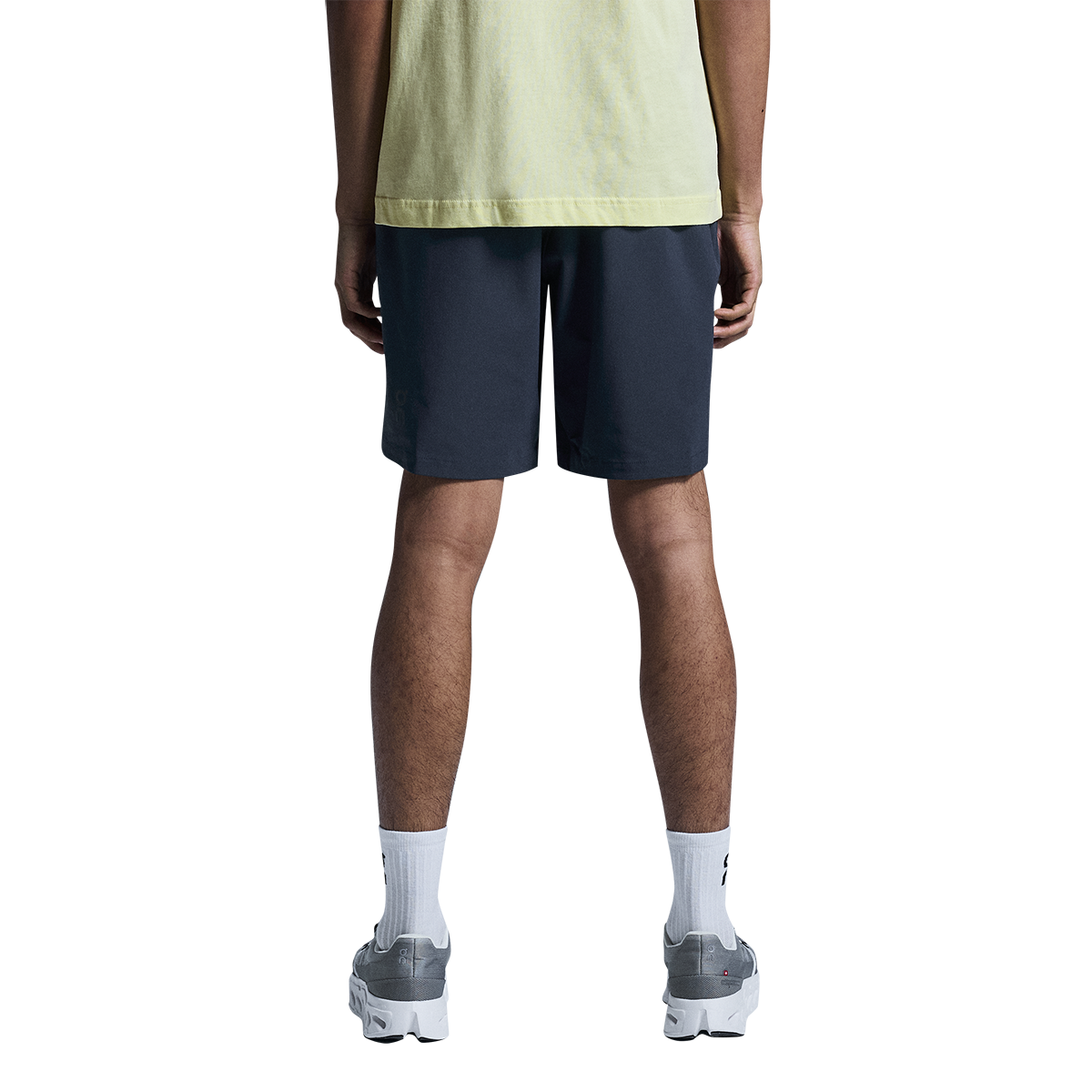 Man wearing navy blue On Focus Shorts from behind showing fit and length