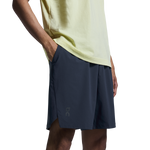 Man wearing On Focus Shorts in navy blue with light green shirt