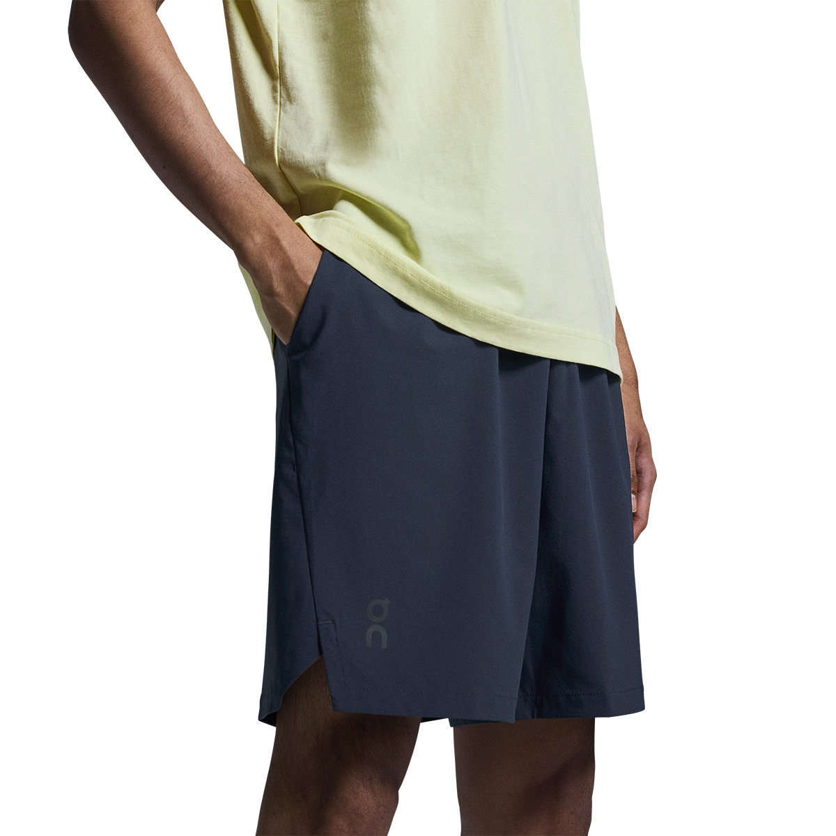 Man wearing On Focus Shorts in navy blue with light green shirt