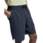 Man wearing On Focus Shorts in navy blue with drawstring waist