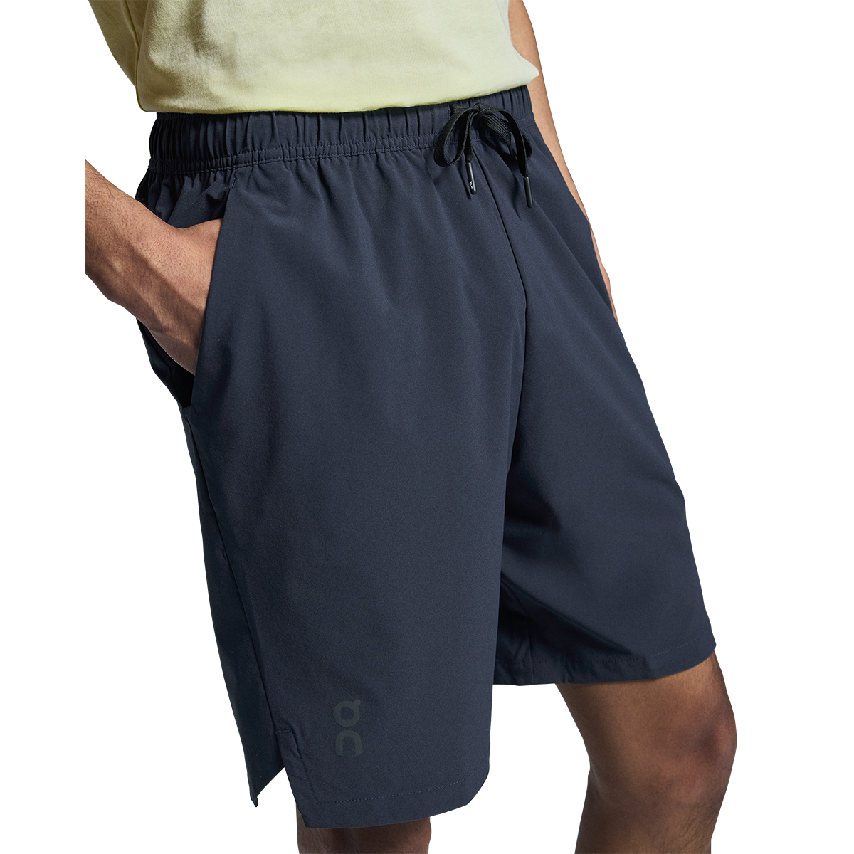 Man wearing On Focus Shorts in navy blue with drawstring waist