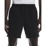 Men's black athletic shorts with drawstring waistband on model