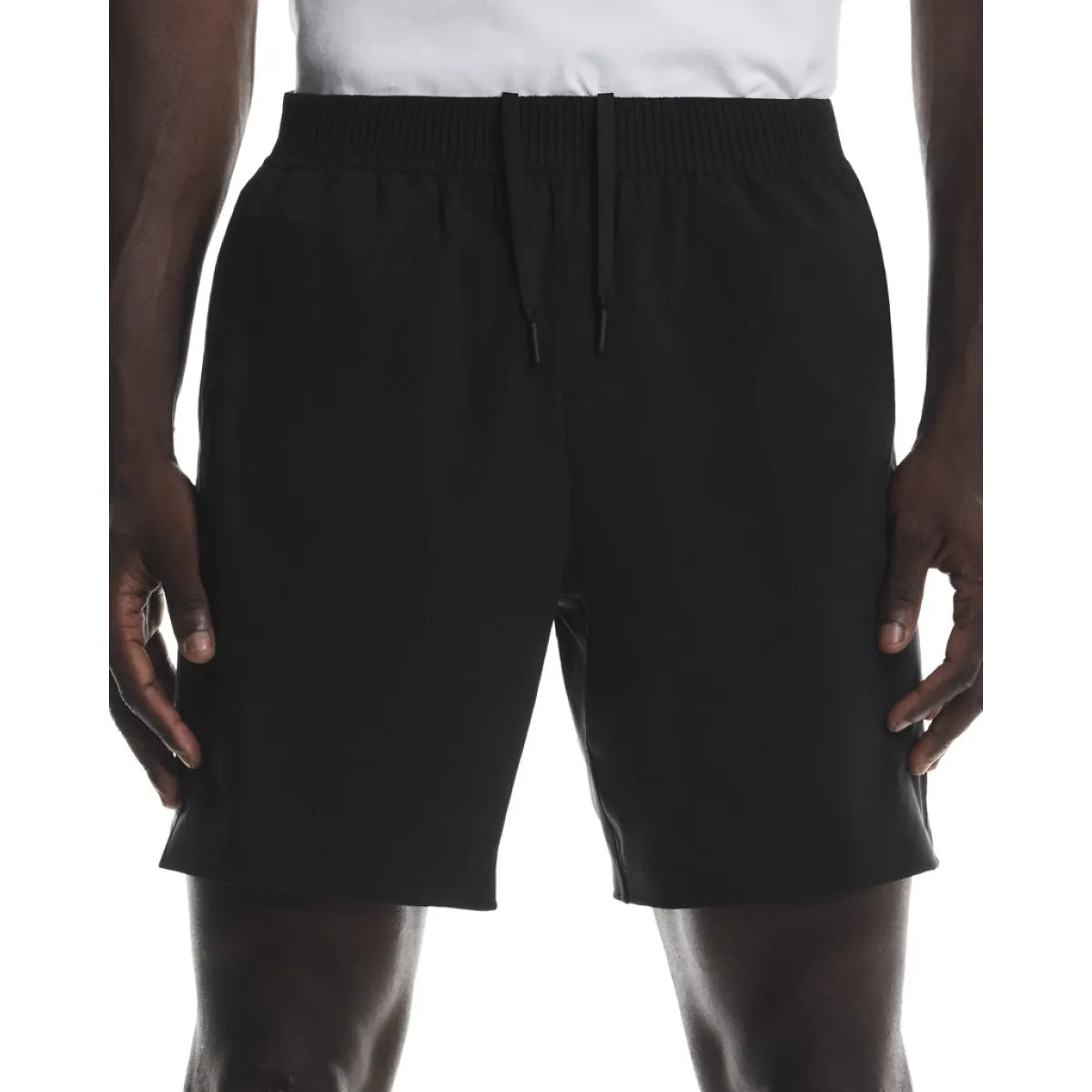 Men's black athletic shorts with drawstring waistband on model