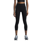 Woman wearing black On Studio Tights 7/8 leggings with gray sneakers