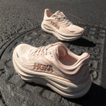 HOKA Bondi 9 women's running shoes in rose latte colorway on textured surface