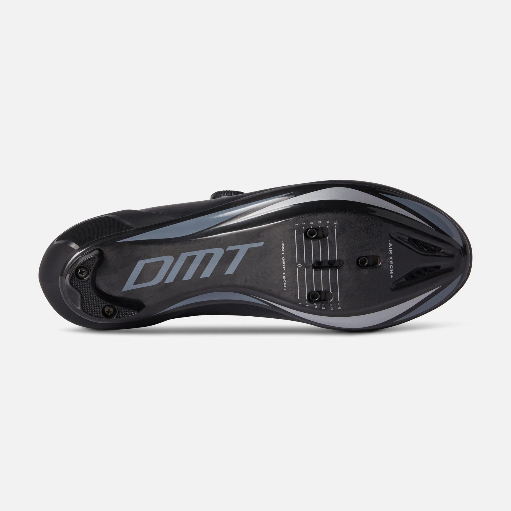 DMT cycling shoe sole view showing black design with gray DMT branding