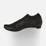 DMT KR1 black knit road cycling shoe with orange accents on clean background