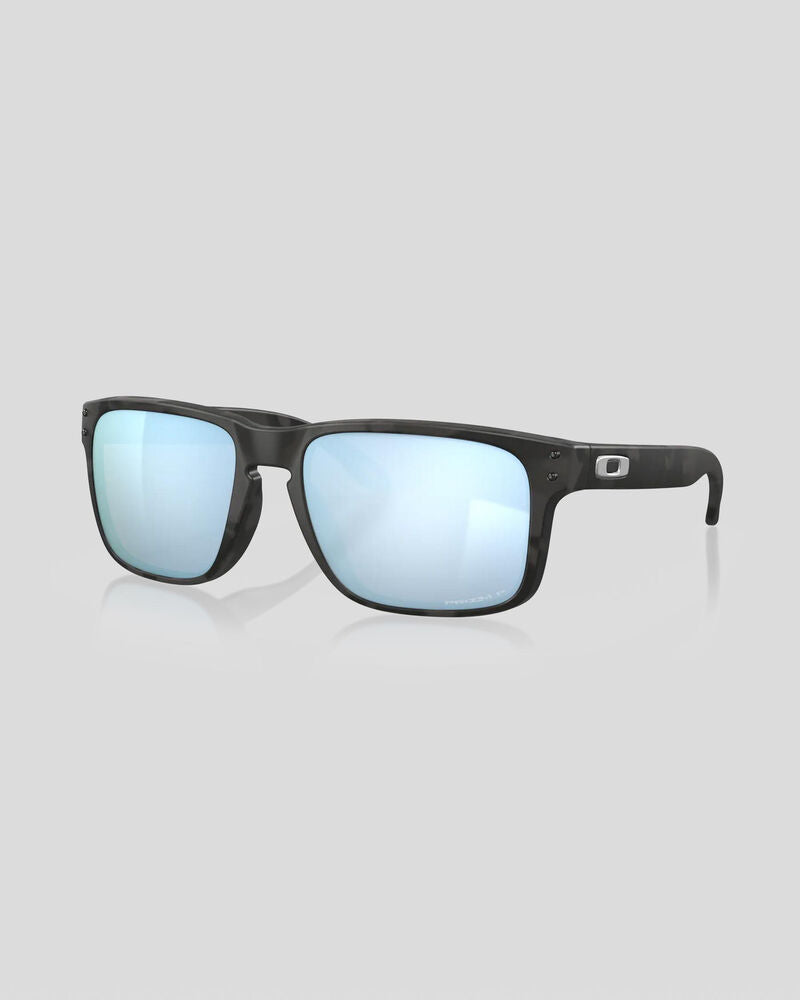 Oakley Holbrook sunglasses with matte black camo frame and blue mirrored lenses