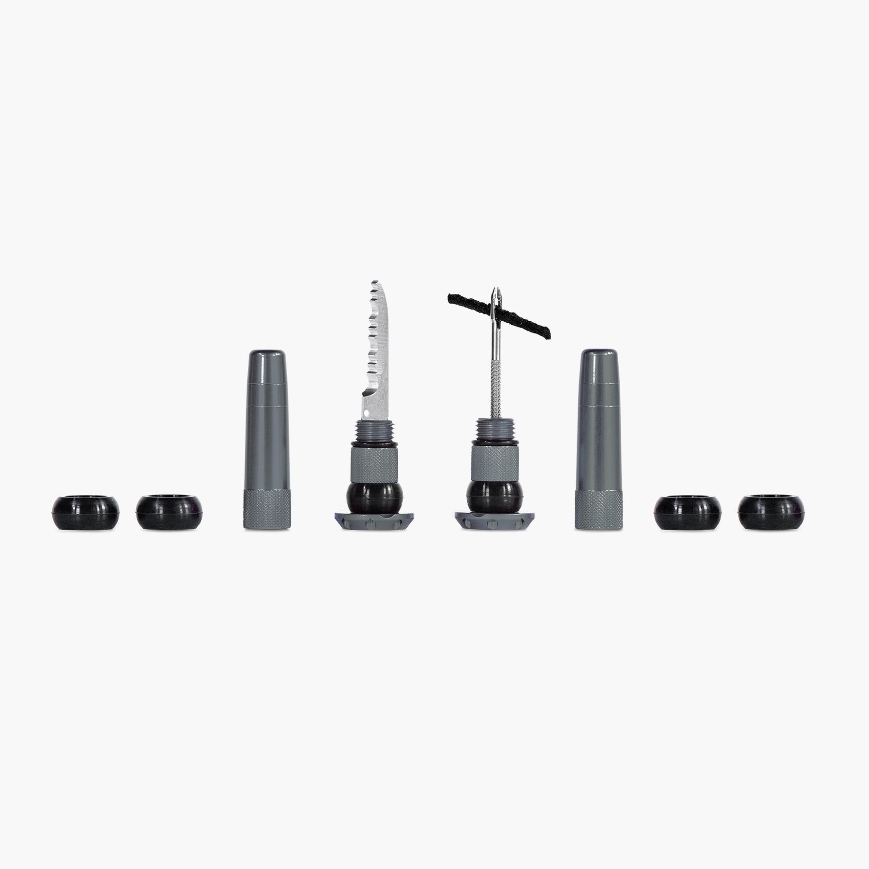 Muc-Off Stealth tubeless tire puncture repair plugs kit with tools on white background