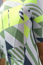 Gobik CX Pro cycling jersey close-up showing geometric pattern in green, white, and navy