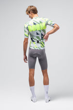Back view of male model wearing Gobik CX Pro cycling jersey with geometric triangle pattern