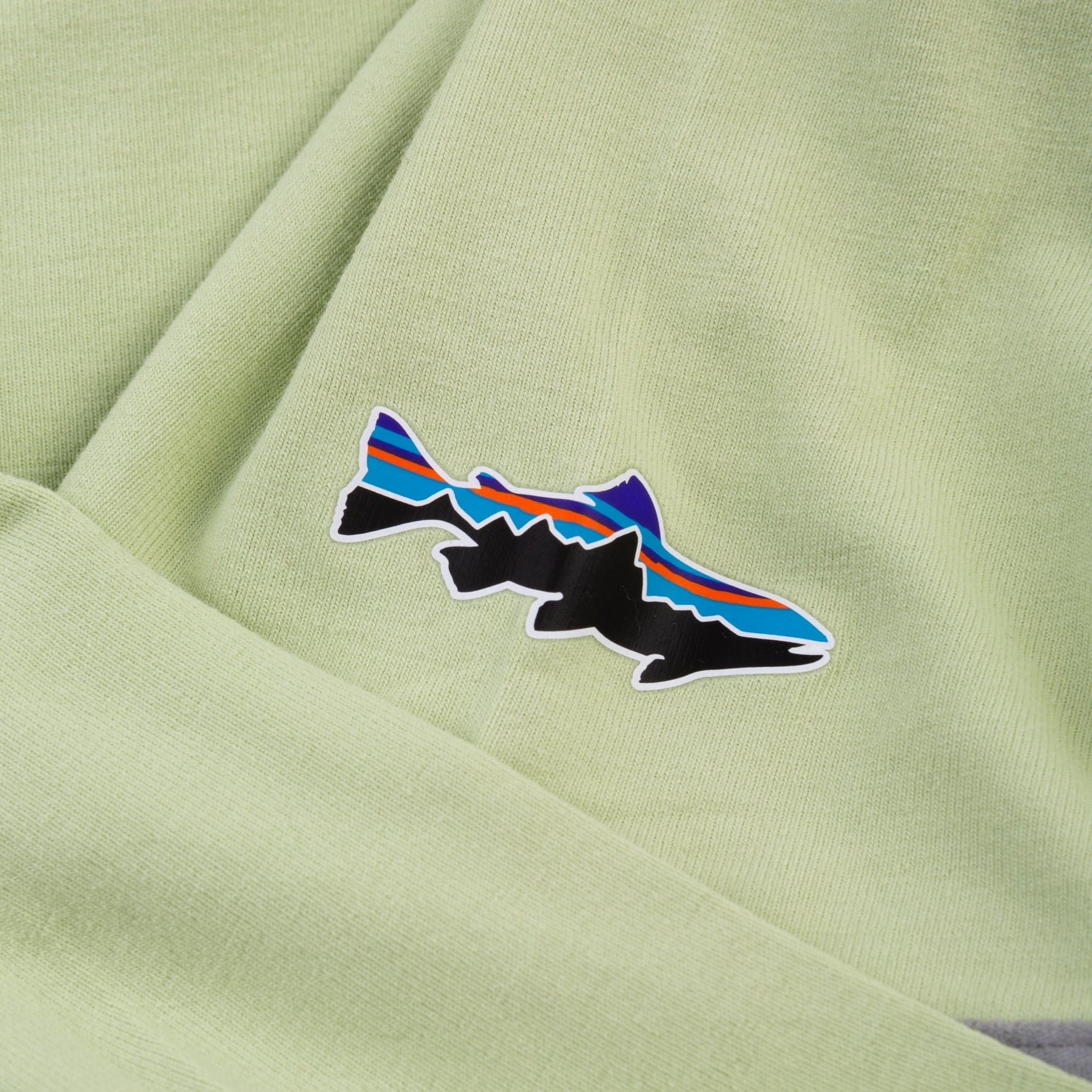 Patagonia Men's Tropic Comfort UPF Hoody in light green with fish logo detail