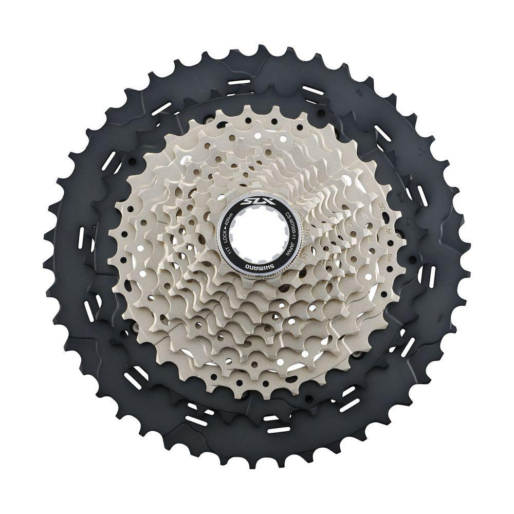 Shimano SLX CS-M7000 11-speed cassette with silver and black sprockets on white background