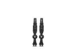 Two black Muc-Off Big Bore Lite tubeless Presta valves on white background