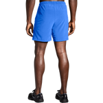 Brooks Moment 7 inch running shorts in vivid blue on male model, rear view