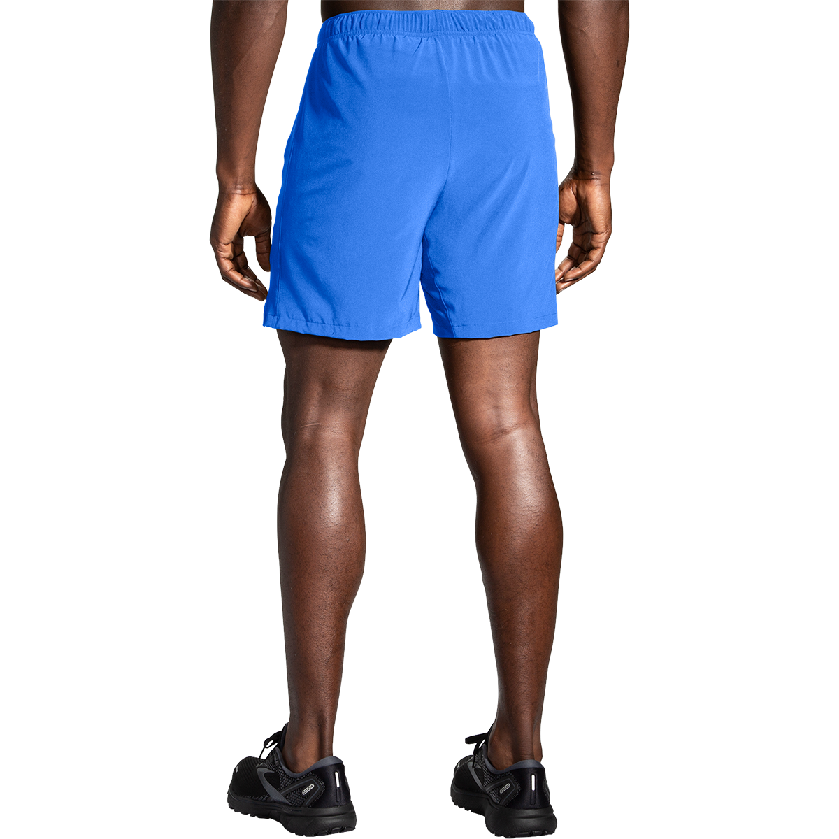 Brooks Moment 7 inch running shorts in vivid blue on male model, rear view