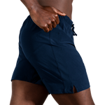 Man wearing Brooks Moment 7-inch running shorts in navy blue