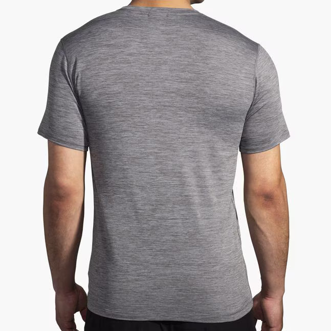 Brooks Luxe Short Sleeve shirt in heathered charcoal shown from back on male model
