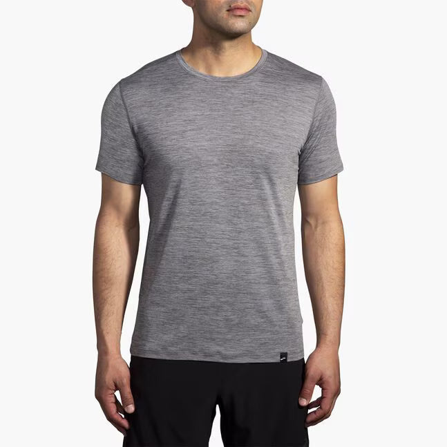 Brooks Luxe Short Sleeve men's running tee in heathered charcoal gray on model