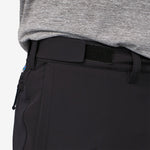 Close-up of black Patagonia trail pants waistband with velcro closure detail
