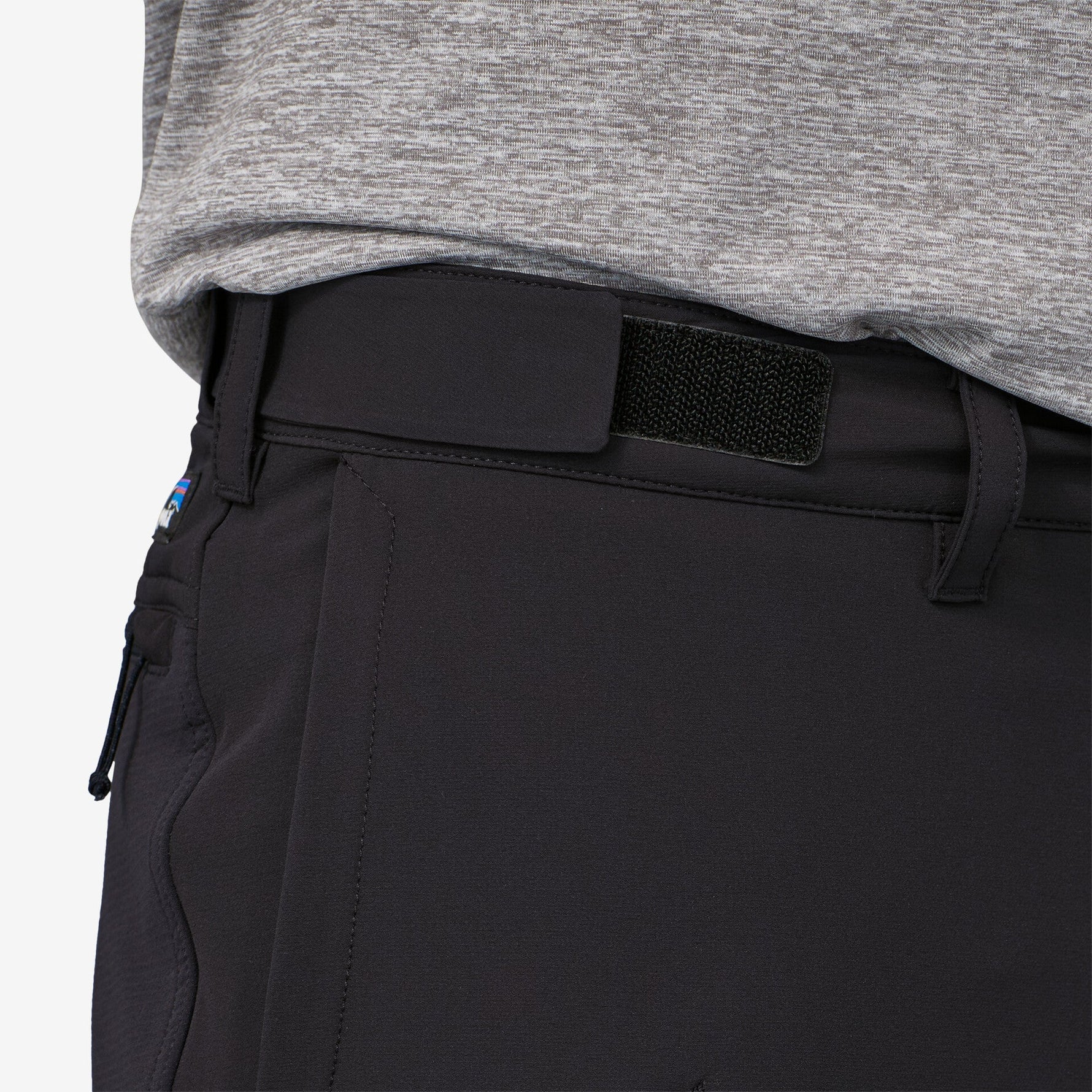 Close-up of black Patagonia trail pants waistband with velcro closure detail