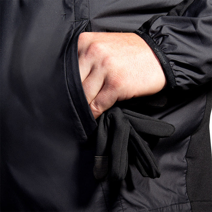 Brooks Fusion Hybrid Jacket 2.0 in black showing pocket detail with gloves