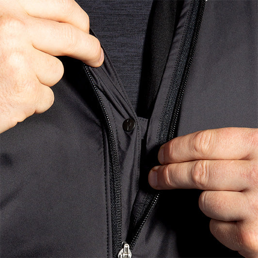 Close-up detail of Brooks Fusion Hybrid Jacket 2.0 black zipper and layering system
