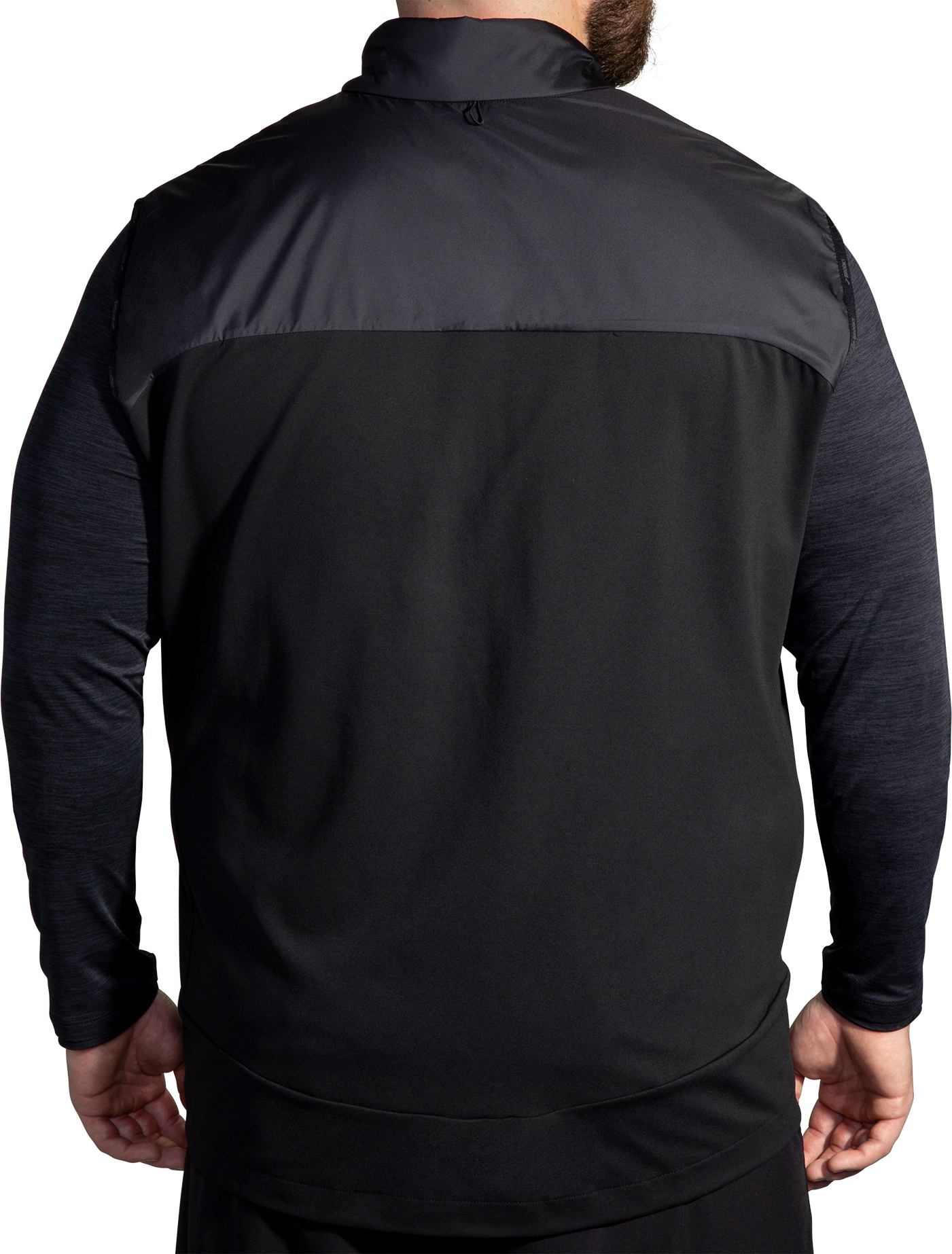 Brooks Shield Hybrid Vest 3.0 in black shown from rear on male model