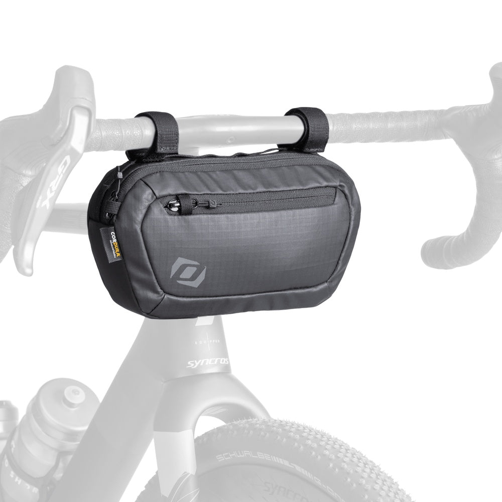 Syncros black handlebar bag mounted on bicycle handlebars with clean studio background