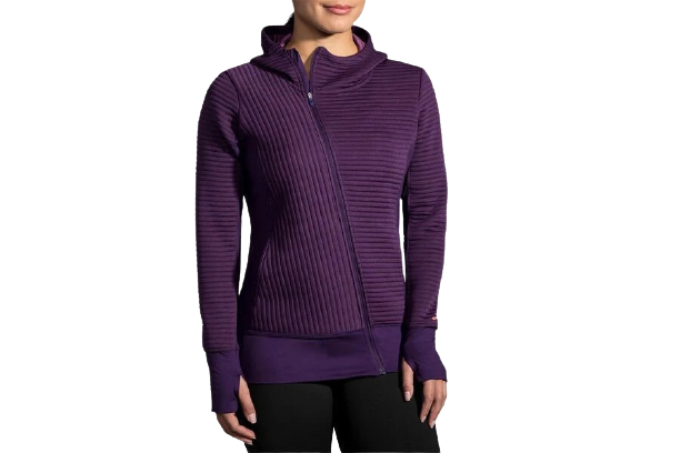 Woman wearing purple Brooks Fly-By Hoodie with textured stripe pattern and hood