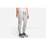 Woman wearing light gray heather Brooks Fremont joggers with ribbed cuffs