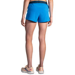 Brooks Chaser 3-inch running shorts in azure blue shown from rear on female model