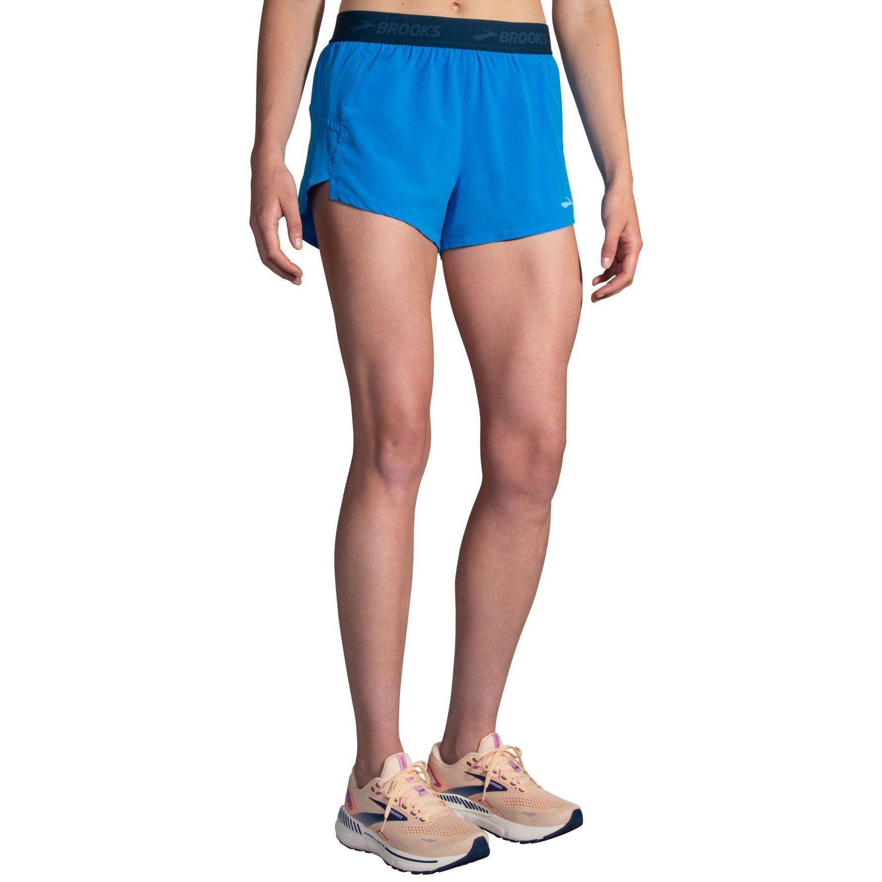 Brooks Chaser 3-inch running shorts in azure blue with branded elastic waistband on female model
